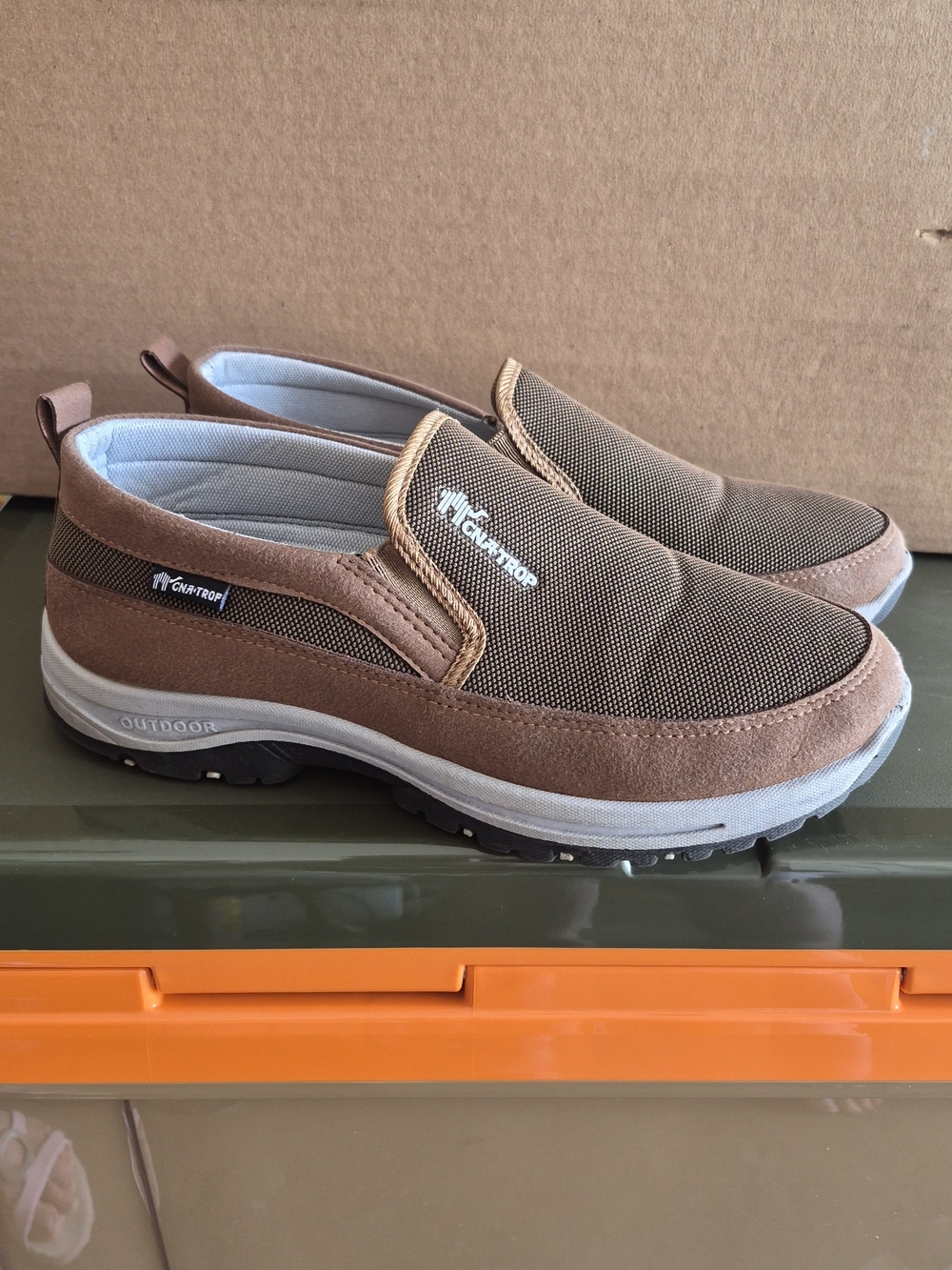 These brown CNA-TROP slip-on shoes feature a breathable mesh Size 10.5